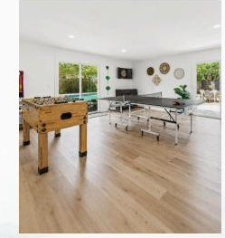 Open game room with foosball and ping pong tables