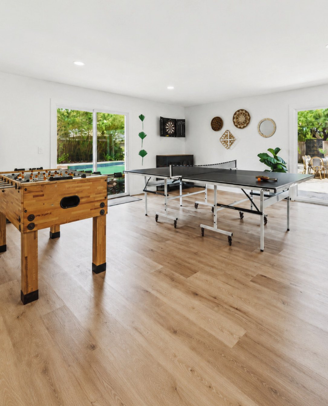 Open game room with foosball and ping pong tables